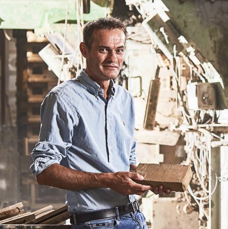 Andreas Christensen holding brick
